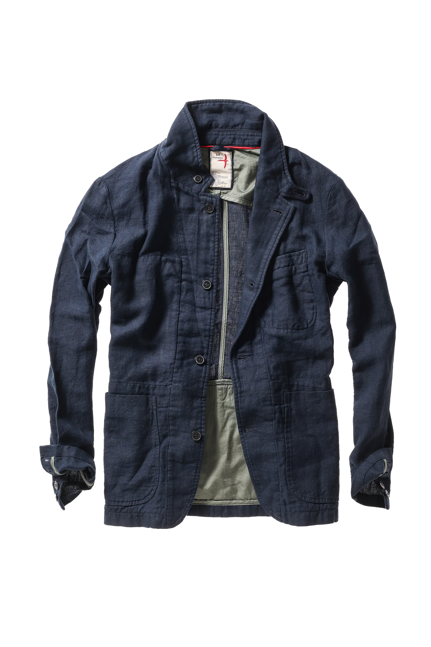 Relwen navy denim blazer with button front closure, multiple pockets, and rolled sleeves worn open over green shirt.