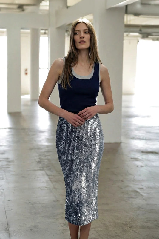 Woman wearing Le Superbe Two Timer Tank in navy with heather grey trim, paired with silver sequined midi skirt.