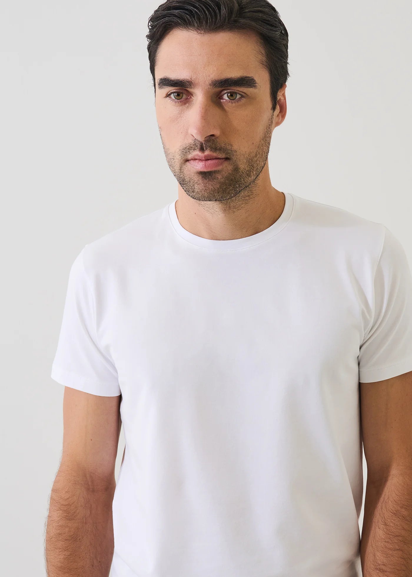 Man wearing Patrick Assaraf short sleeve white pima cotton crew neck t-shirt in classic fit